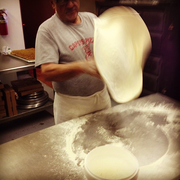 Day at 's , every . Owner Tony  making pizza for slices.
